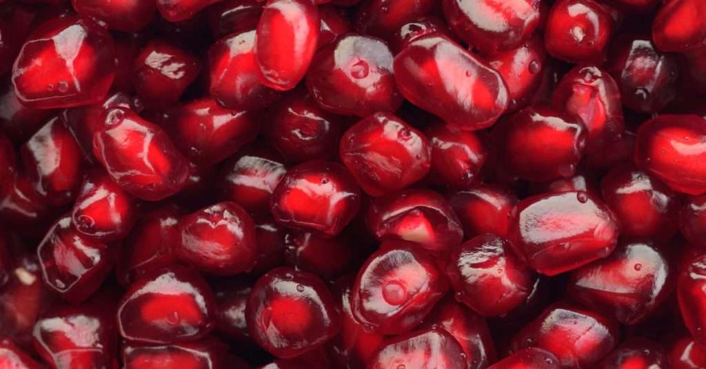 pomegranate seeds are loaded with vitamins and minerals.  A pile of juicy red seeds. 